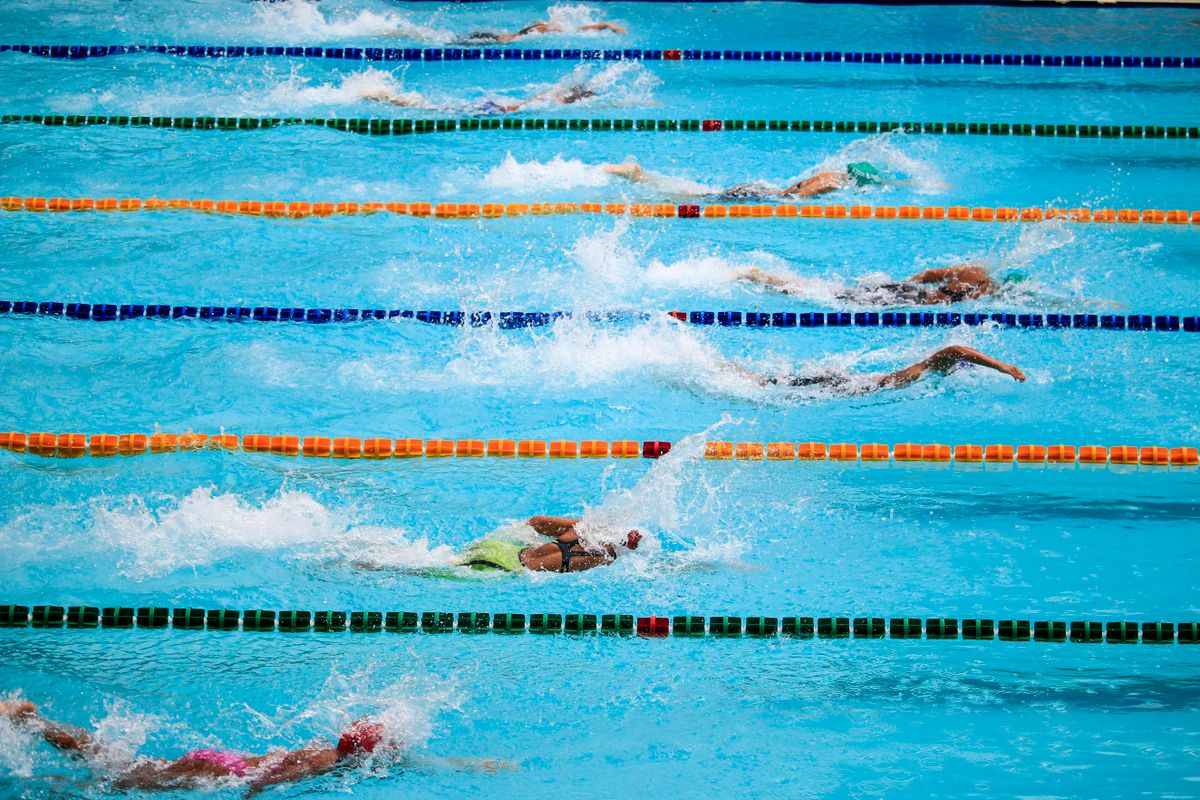 A swimmer rotating to the side to take a breath during freestyle.