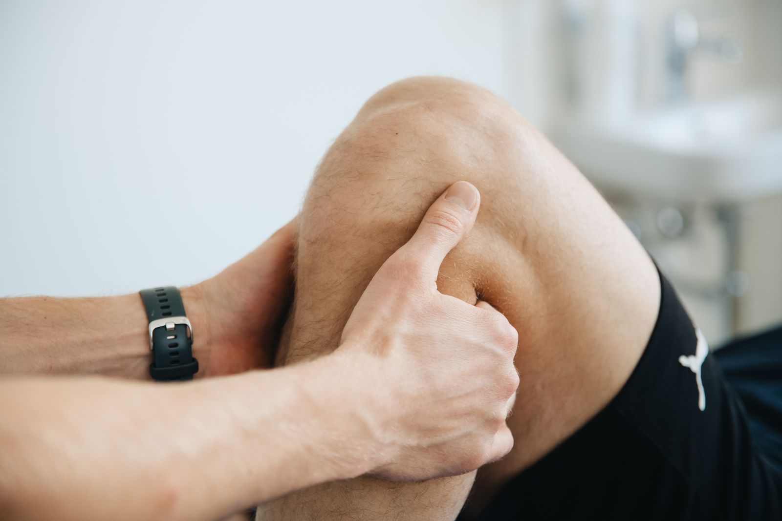 Sports massage on the knee during a regular recovery session.