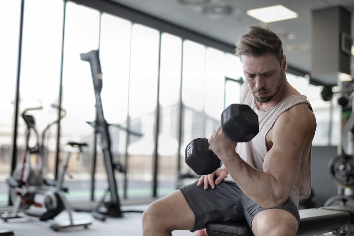 Lifting a dumbbell, scalable strength training for any age.