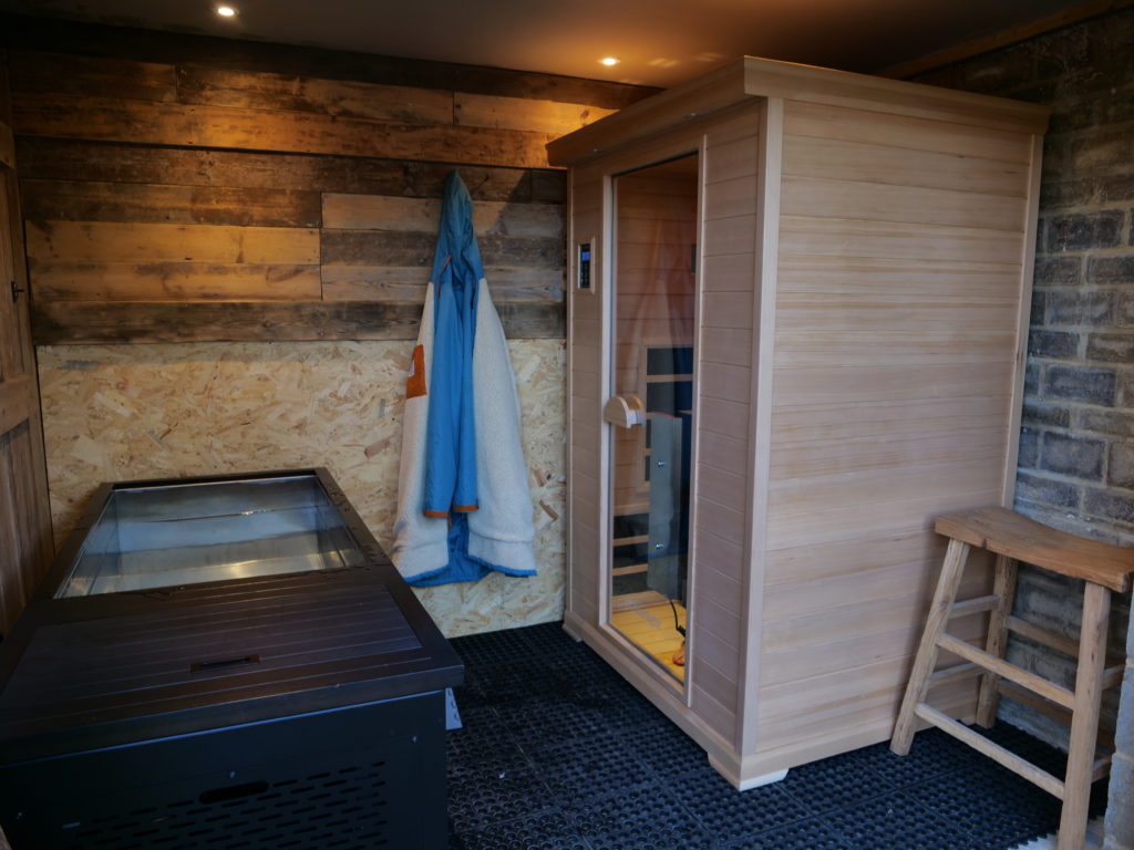 Cold plunge and infrared sauna side by side in David Lucas cold therapy suite