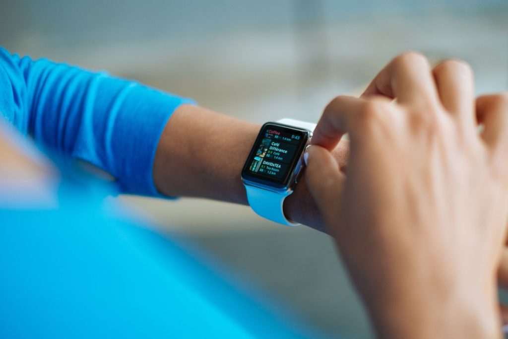 A sports smartwatch on the wrist, the wearable tech that tracks swim stroke and form data